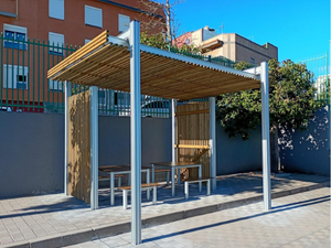 Modular pergola with wall and polycarbonate enclosure and integrated tables and benches