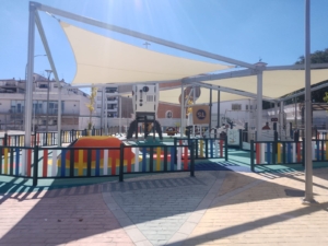 Set of two double textile shade structures measuring 14 × 7 metres in a children’s playground in Málaga (Ronda)